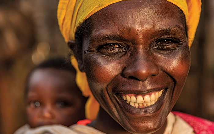 smiling African woman with baby